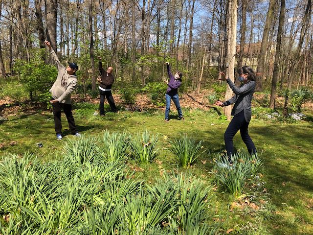 qi gong group outdoors with safety masks